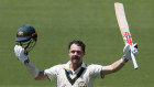 Travis Head celebrates his century in Adelaide.