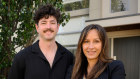 Kristen Kubank with one of her sons Angus, in front of her new investment property that she bought for her kids to rent