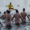 Nude swimmers take the plunge for charity in Lake Burley Griffin