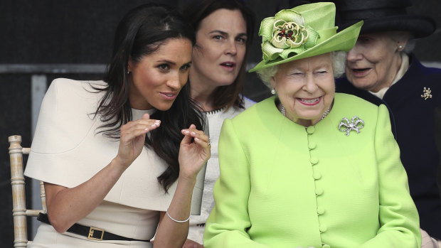 Meghan, the Duchess of Sussex (left), wearing Givenchy, with the Queen last month.