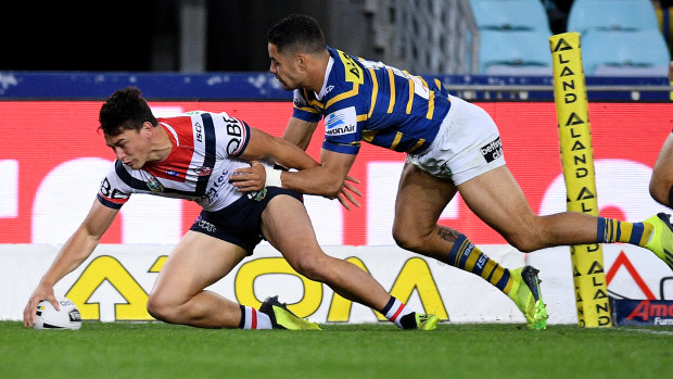 Sign of things to come: Joseph Manu opens the scoring for the Roosters.