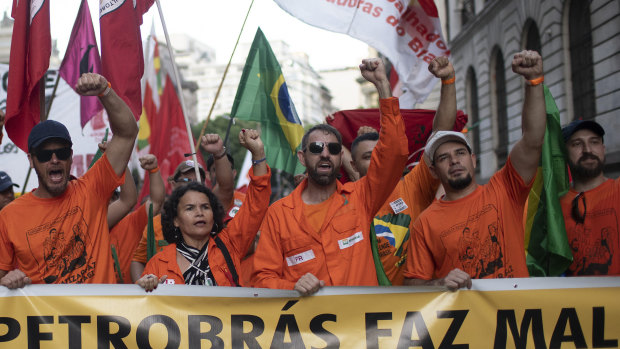 Oil workers march against layoffs at the state oil company Petrobras in Rio de Janeiro, Brazil, on Tuesday.