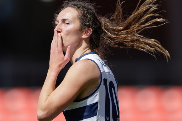 Georgia Rankin of the Cats celebrates a goal against the Suns.