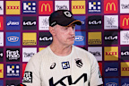 Maguire speaks to reporters on Wednesday.
