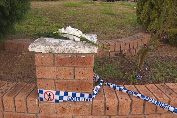 Floral tributes have grown outside the south-west Sydney home.