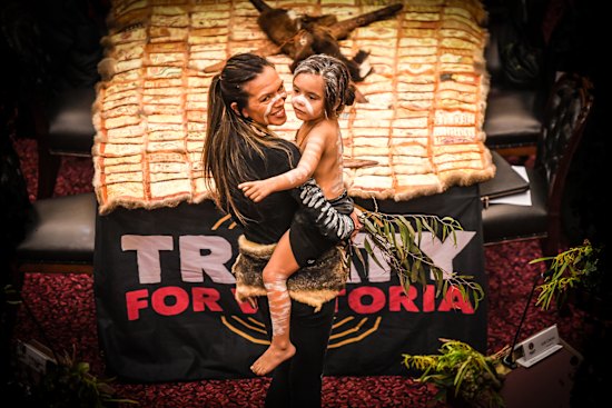 Teena Moffat with child at the induction of the First Peoples’ Assembly of Victoria in 2023.