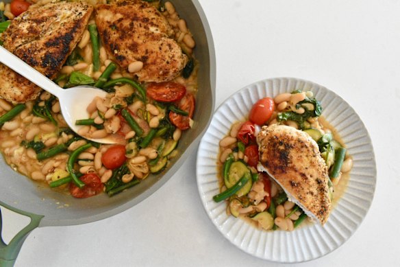 White beans and seasonal vegies add substance to this one-pan chicken dish.