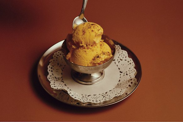 Saffron ice-cream topped with pistachios.