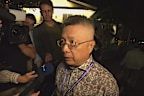 Chinese special envoy to the Pacific Qian Bo speaking to reporters in Palau.