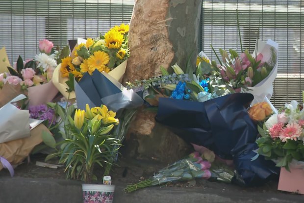 Tributes have grown near the scene of Friday’s crash.