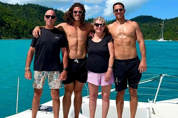 Perth men Jake and Callum Robinson were honoured in a paddle out as the community embraced the boys' heartbroken parents.