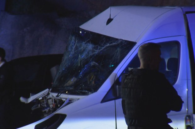 The Porsche, driving on the wrong side of the road, collided with a van.