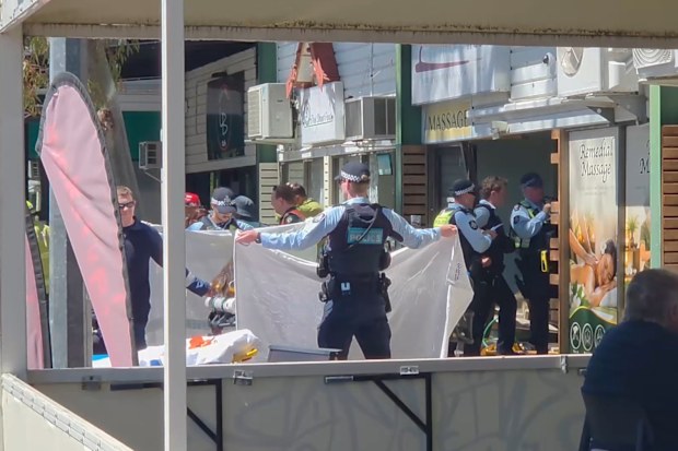 A Canberra massage shop has been left in ruins after being ploughed into by a car, leaving three workers trapped underneath the vehicle.