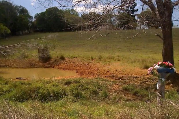 A girl and her step-mother were killed when their car crashed into a dam on the Fraser coast, with the girl’s father making the grim discovery.