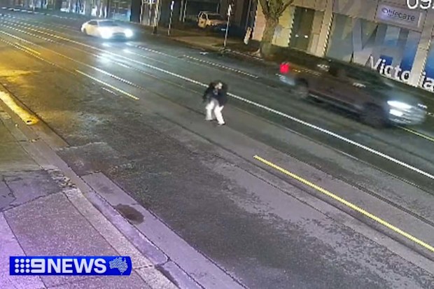 A man in his 50s is fighting for life after allegedly being bashed and stabbed on a busy Melbourne street.
