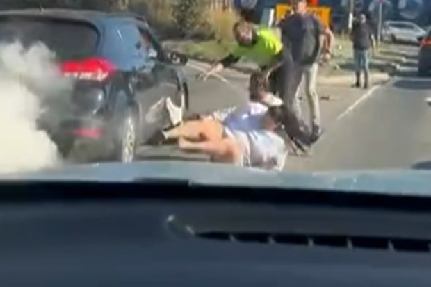A man has allegedly carjacked a woman on a busy motorway in Sydney’s west with two kids in tow.