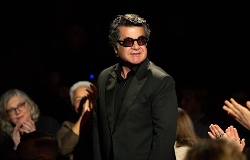 Jafar Panahi is applauded on the opening night of Sydney Film Festival on Wednesday.