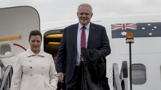 Prime Minister Scott Morrison and his wife Jenny arrive at Farnborough airport in London on Tuesday.