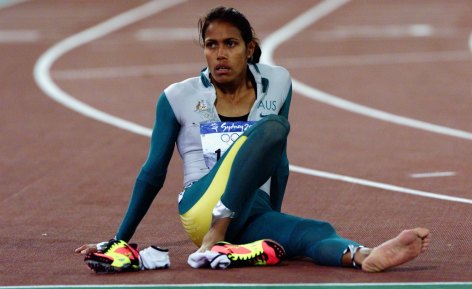 Cathy Freeman takes it in after winning the 400 metres at the Sydney 2000 Olympic Games.