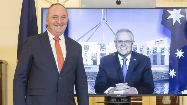 Barnaby Joyce is sworn in as deputy Prime Minister while Scott Morrison looks on via video. 