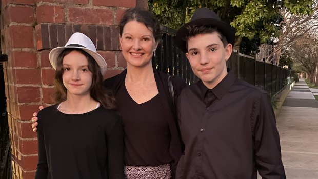 Deborah Holtham, with daughter Shala and son Campbell outside Wesley College, says she has prioritised school fees to support her children’s musical interests.