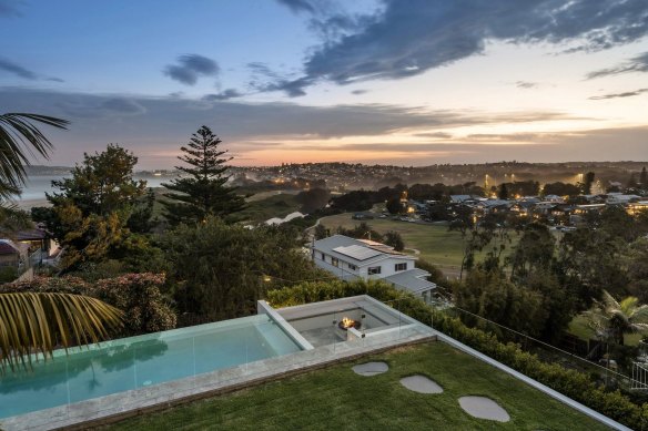 The designer residence is set on a rise overlooking North Curl Curl Beach.