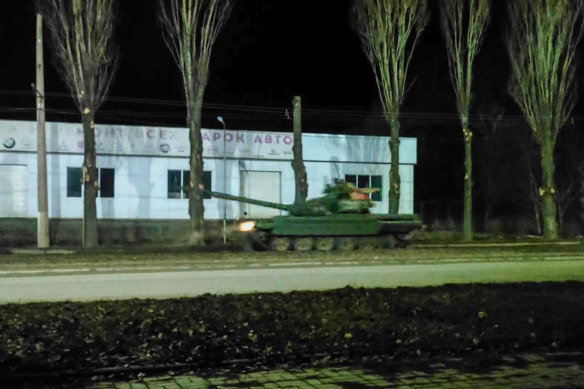 This is a screenshot captured from a video showing Russian military tanks advance in the Russian separatist-controlled part of the Donbas region.