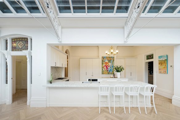 The Victorian residence features ornate ceiling frames, Herringbone parquetry floors, a kitchen and wine room.