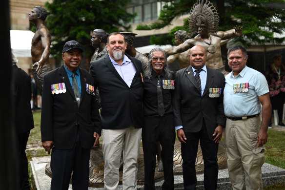 Ray Rosendale (second from left) with fellow Indigenous servicemen (from left) Pat Mills, Marsat Ketchell, Ken Neliman and Donald Taylor at an RSL Queensland service in Anzac Square on Saturday.