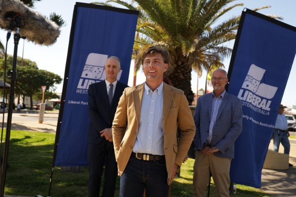 North West Central candidate Will Baston, flanked by Liberal leader David Honey, left, and Liberal MLC Neil Thompson.