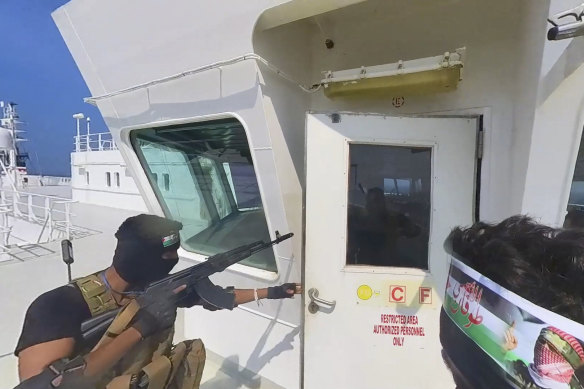 Houthi forces board a cargo ship in the Red Sea late last year.