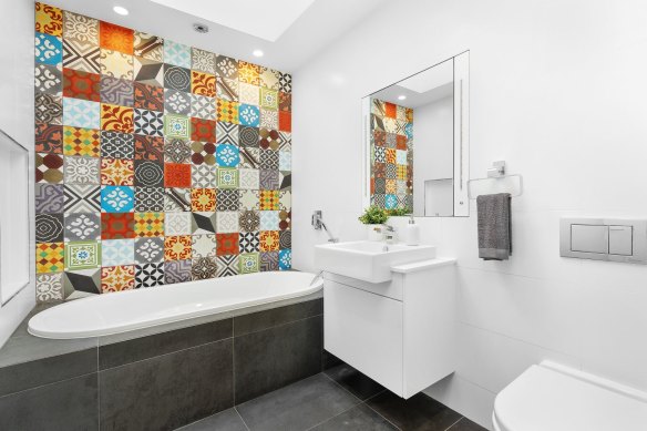 The patterned bathroom tiles.