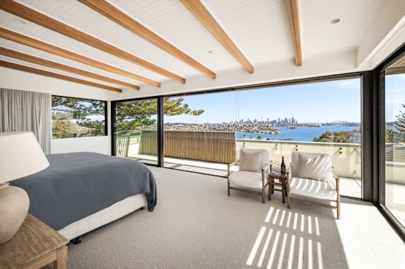 The abode has a nod to the Hamptons with beamed ceilings in the master and earthy tones.