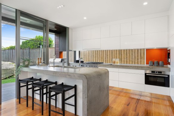 The kitchen and living area flow from indoors to outdoors.