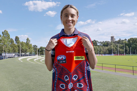 Aliesha Newman with the Indigenous jumper she designed for the Demons in 2021.