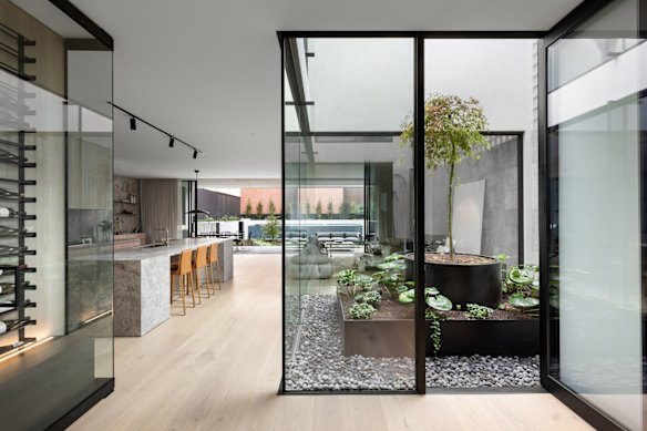 The contemporary home has four bedrooms and five bathrooms.