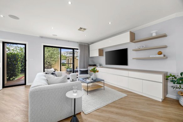 The three-bedroom townhouse at Sylvania was marketed as low-maintenance living, with features including ducted aircon and a double garage with internal access.