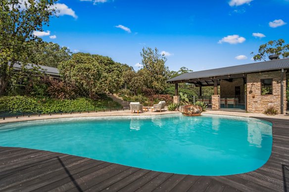 On offer is a six-bedroom, three-bathroom house with a pool, tennis court and sauna, on three hectare grounds and surrounded by pristine bushland. 