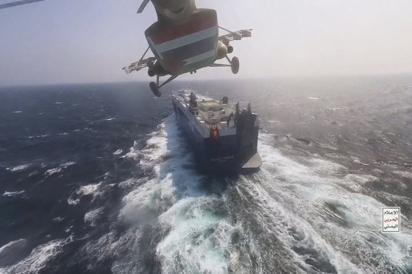 A Houthi forces helicopter seizing the cargo ship Galaxy Leader in the Red Sea in November 2023.