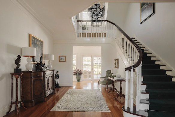 The Hamptons-inspired home features polished timber floors and plantation shutters.