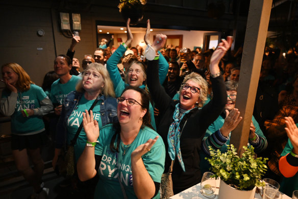 Supporters of teal independent Monique Ryan celebrate on election night.