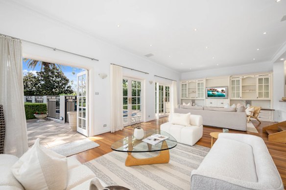 Three families battled for the keys to 1 Iluka Place on Saturday. The winning bidders were a family from Caringbah keen to get closer to the beach.