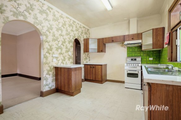 The kitchen featured bright-green tiles.