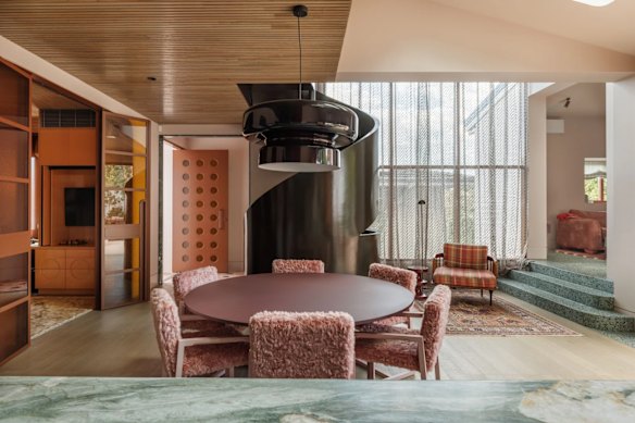 A glossy spiral staircase is a focal point of the property.