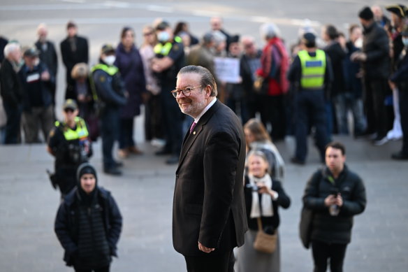 Bernie Finn on the steps of the Victorian parliament with a group of supporters on Tuesday.