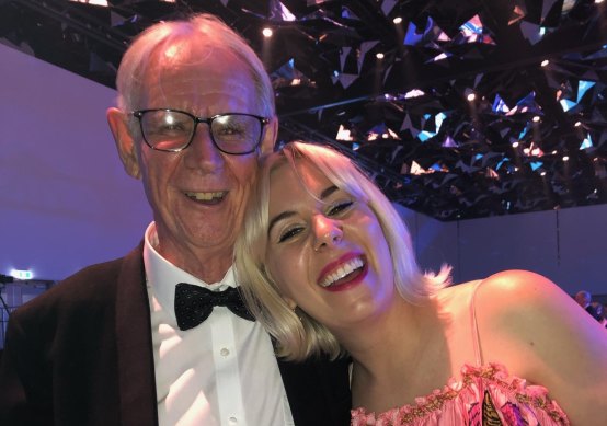 Mick Barnes with his daughter Jess after he won an award for best short feature, “Counting down the days in God’s waiting room”, which appeared in Good Weekend in 2018.