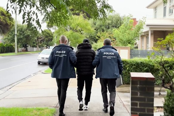 Ibrahim Haddara is led away by police on Tuesday morning.