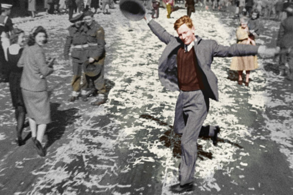 Dancing Man on George Street, Sydney during V Day celebrations. This colourised image was part of the documentary, Australia in Colour.
