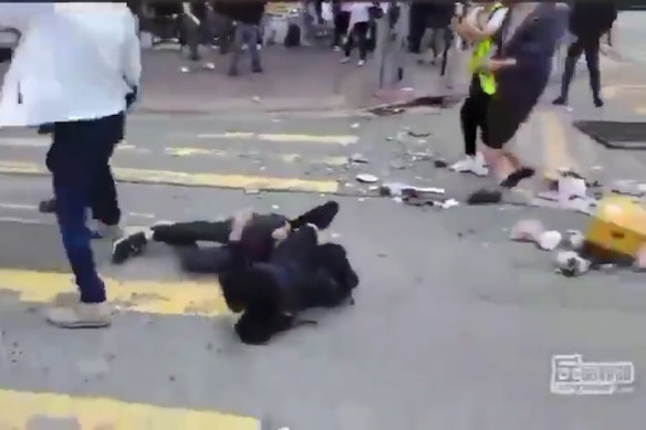 The protester crumples to the ground after being shot. 