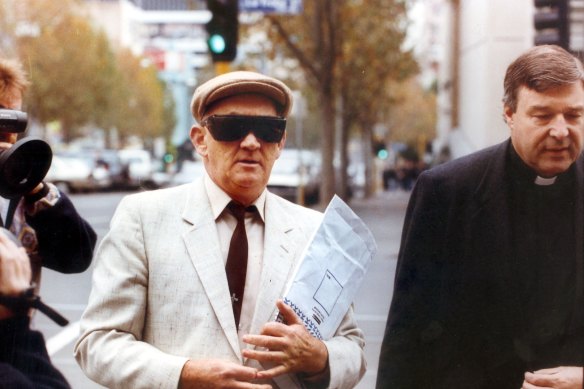 Gerald Ridsdale outside court in 1993, accompanied by George Pell.